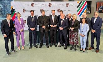 Merz unterzeichnet Vereinbarung für Olympiabewerbung